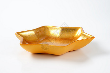 金金星碗金子陶瓷制品星形甜点陶器餐具背景图片