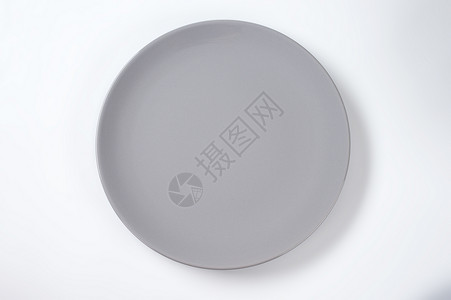 灰色晚餐盘纯色灰色制品陶器圆形陶瓷高架沙拉盘餐具轿跑车板背景图片