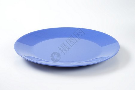 蓝色晚餐盘陶器餐盘轿跑车板圆形餐具制品纯色陶瓷背景图片