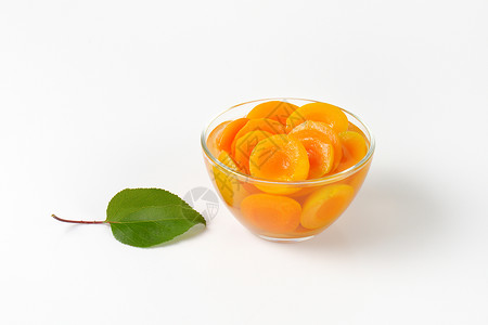 一碗杏子酱罐装罐头玻璃甜点水果糖浆食物背景图片