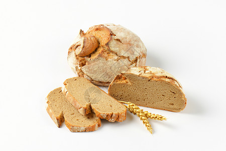 新鲜的结壳面包圆形横截面面包棒硬皮麦穗食物谷穗工匠背景图片