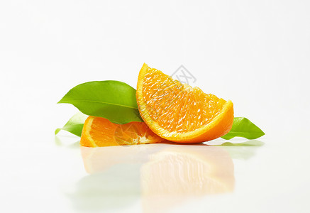 新鲜橙红切片食物楔子水果背景图片