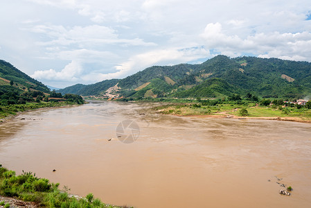 湄公河橙子场景热带绿色环境天空边疆边界风景农村背景图片