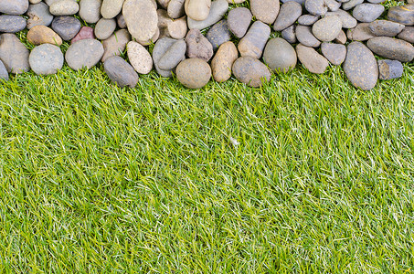 草地上的石头材料花园路面公园岩石绿色灰色碎石背景图片