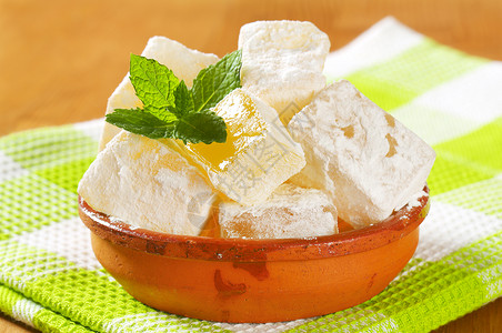 希腊语土耳其语喜悦甜点软糖立方体明胶涂层美食糖果乳香正方形食物背景图片