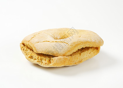 环形面包卷小吃面包食物烤箱甜甜圈形美食背景图片