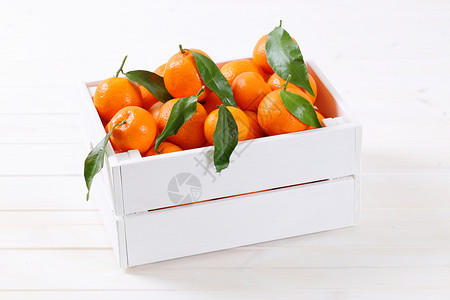 有叶子的新鲜柑橘白色食物水果盒子团体收成背景图片