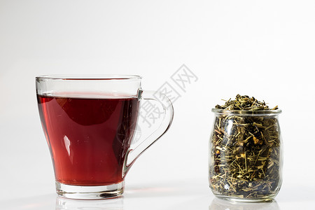 白色背景的茶杯中的茶 绿色或水果茶橙子饮料工作室药品草本植物早餐茶点液体食物盘子背景图片