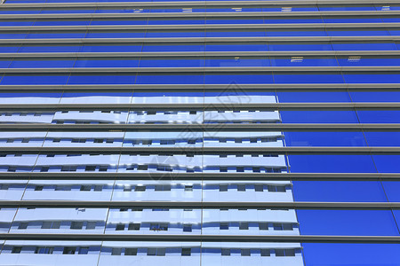 玻璃建筑物巴塞罗那玻璃办公室大楼巴塞罗纳玻璃晴天景观建筑物标志性总部商务反射办公城市背景