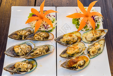 贝壳类海鲜新西兰的贝壳类贝类烧烤美食午餐海鲜营养烹饪蛤蜊香菜柠檬背景
