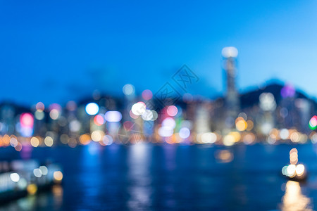 香港的模糊视图地标商业日落金融城市街道建筑蓝色背景反射背景图片