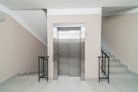 电梯和楼梯建筑学金属走廊酒店楼梯间天花板商业建筑办公室入口背景图片