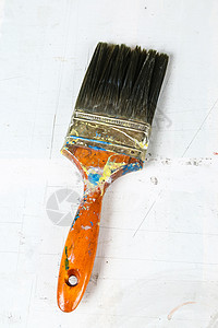 特写旧油漆刷子画笔艺术工作工具黑色乐器背景图片