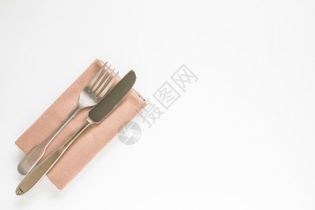 白棕褐色餐厅餐巾纸 用刀叉和叉子制模版背景图片