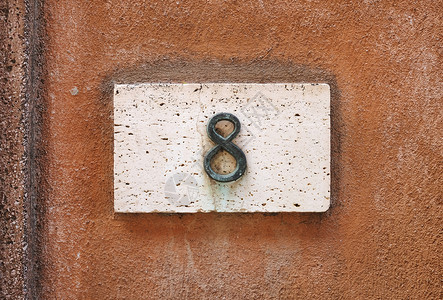 墙上的房号牌匾指标建筑房子金属黏土数字风化地址街道背景图片