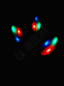 深色背景中的彩色球体光舞蹈电子黑色辉光橙子海浪活力均衡器力量蓝色背景图片