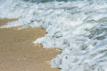 沙滩和海洋泡沫海浪蓝色海滩海岸背景图片