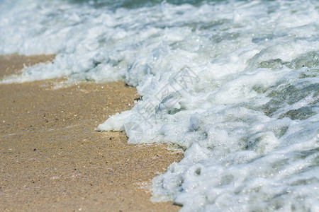 沙滩和海洋泡沫海浪蓝色海岸海滩背景图片