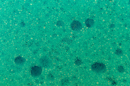 泡沫粒子海绵的纹理厨房清洁工细胞宏观泡沫纤维淋浴韧皮拭子擦洗背景
