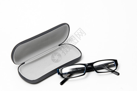 眼镜玻璃杯塑料镜片棕色配饰光学医疗框架盒子黑色玻璃背景图片