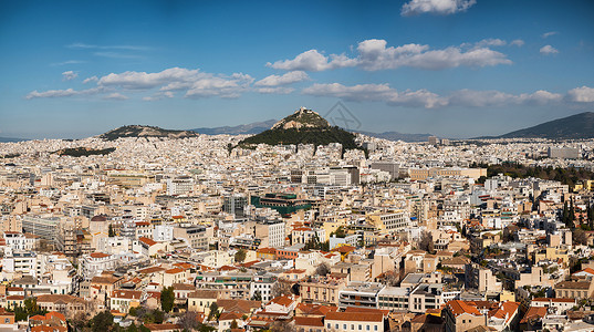雅典在大都会周围的古迹剧院中心建筑学天空旅游神话古城大理石废墟蓝色背景图片