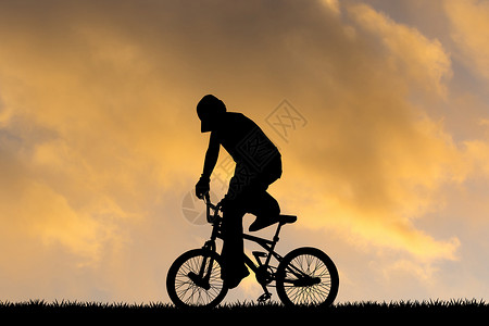 日落时进行自行车试验男生插图运输轮子把手太阳杂技背景图片