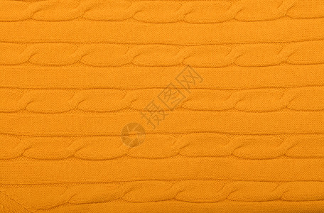 编织的羊毛织布背景 特写纹理球衣黄色针织织物经编纺织品材料橙子背景图片