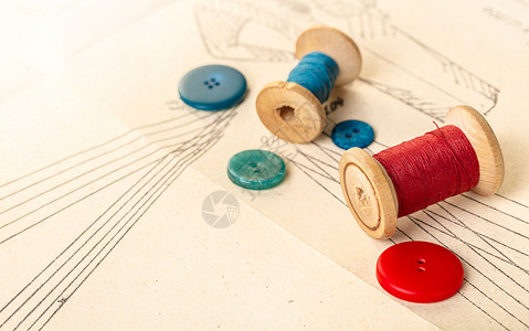 纸卷轴彩色线的线圈线程棉布织物配件红色蓝色卷轴材料衣服手工背景