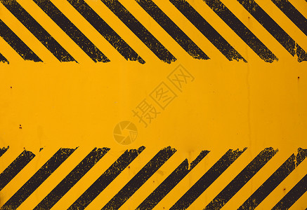 黄色背景与黑色 grunge 危险标志横幅警报工业框架边界风化注意力警告对角线条纹背景图片