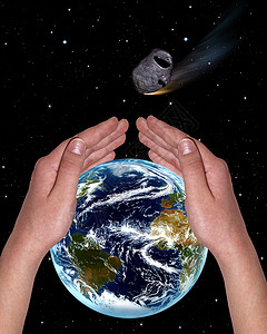 覆盖着地球的手背景图片