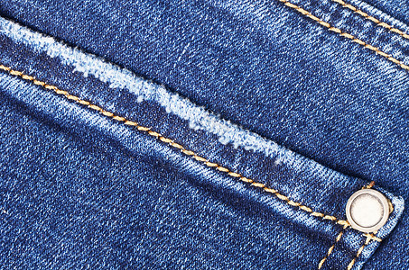 深蓝色按钮深蓝色女性牛仔裤  织布结构纺织品零售纤维裤子衣服牛仔布蓝色材料棉布服装背景