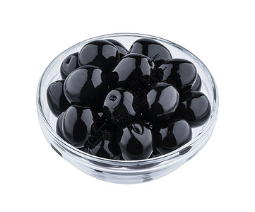 玻璃罐中的谷子黑色在白背景和剪切路径上隔离的黑色橄榄蔬菜食物包装小路剪裁玻璃白色水果宏观背景