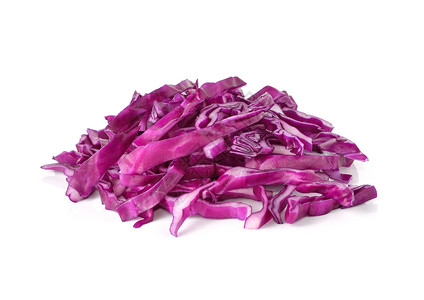 白色背景上的红白卷心菜沙拉烹饪蔬菜食物色拉旋转树叶紫色背景图片