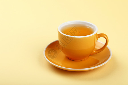 黄茶杯绿色乌龙茶黄色草本杯子飞碟健康饮料背景图片