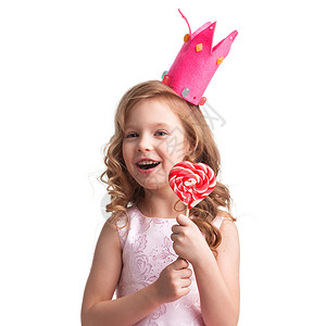 皇冠女孩女孩在皇冠 握着心脏棒棒糖孩子喜悦情感微笑裙子童年糖果女性童话乐趣背景