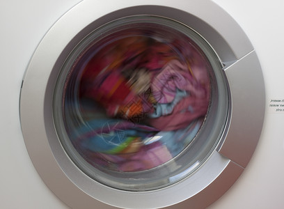 彩色洗衣蓝色旋转红色洗衣机圆形窗户背景图片