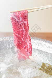 涮涮锅食物洋葱牛肉烹饪美食用餐盘子背景图片
