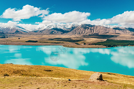 约翰亨利来自新西兰约翰山的Tekapo湖视图天空反射粉色风景旅行蓝色季节公吨绿色旅游背景