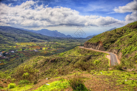 加那利群岛特内里费西北山区的公路跑步前锋全景天空旅行驾驶树木丘陵基础设施速度背景