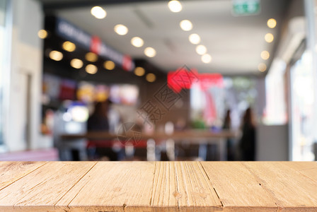 空木制桌 在抽象模糊的CO背景前零售咖啡建筑展示窗户产品柜台咖啡店餐厅架子背景图片