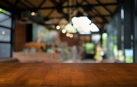 在抽象模糊bokeh背面的空暗黑木桌前g场景产品柜台背景商业街道市场店铺咖啡店展示背景图片