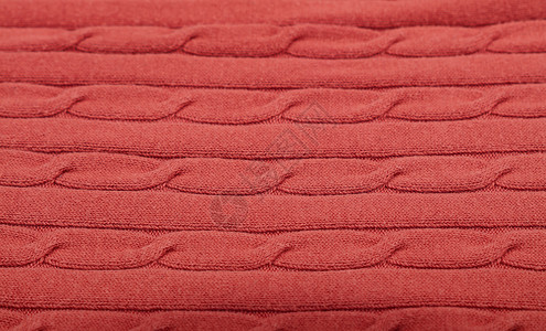 编织的羊毛织布背景 特写纹理球衣织物经编珊瑚材料粉色红色针织纺织品背景图片
