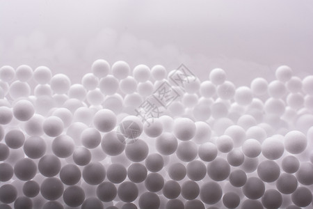 作为背景的白色聚苯乙烯泡沫球惊喜材料防震派对宏观节日商品玩具庆典包装背景图片