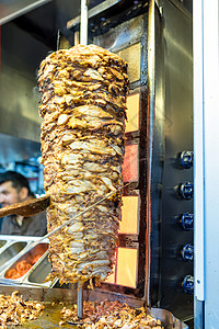 切切土耳其传统食品主厨Shawarma鸡捐赠者美食陀螺仪烧烤男人午餐食物炙烤烹饪火鸡背景图片