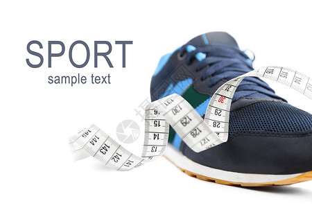 运动鞋和测量胶带 健身概念背景图片