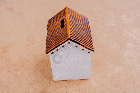 棕色背景的小模范房子住宅商业房屋财产抵押住所住房建筑小屋背景图片