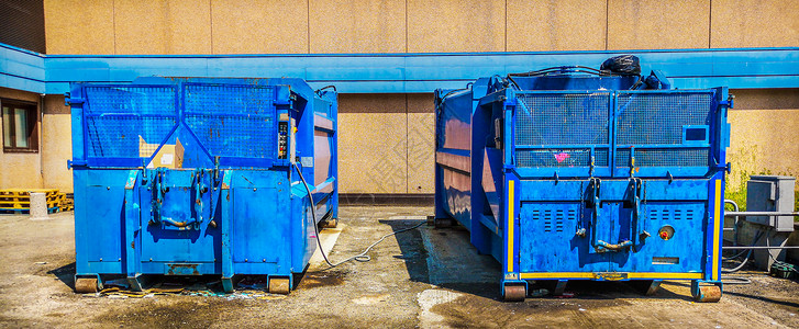 集装箱垃圾压缩机工业垃圾处理厂的垃圾背景图片