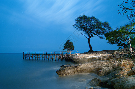 苏拉威西印度尼西亚Takalar的Topejawa海滩旅游热带旅行蓝色海洋场景地平线太阳全景日出背景