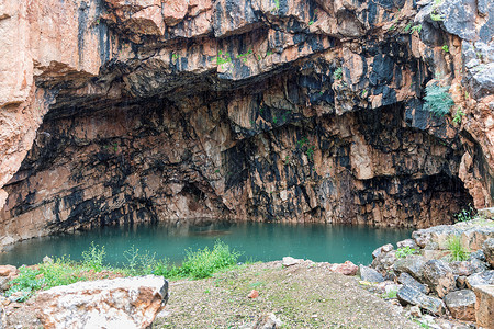戈兰高地在伊斯雷尔的上帝潘神的格罗托圣地悬崖吸引力建筑学旅行若虫平底锅石头寺庙洞穴背景