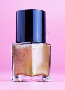 瓶黄金指甲油化妆品指甲搪瓷女性化液体粉色工作室瓶子紫色美甲背景图片